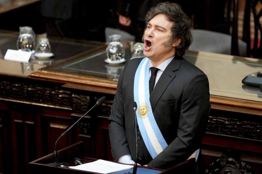 Argentina's President Javier Milei sings the national anthem as he addresses Congress to present the 2025 budget in Buenos Aires, Argentina, Sunday, Sept. 15, 2024. (AP Photo/Natacha Pisarenko)