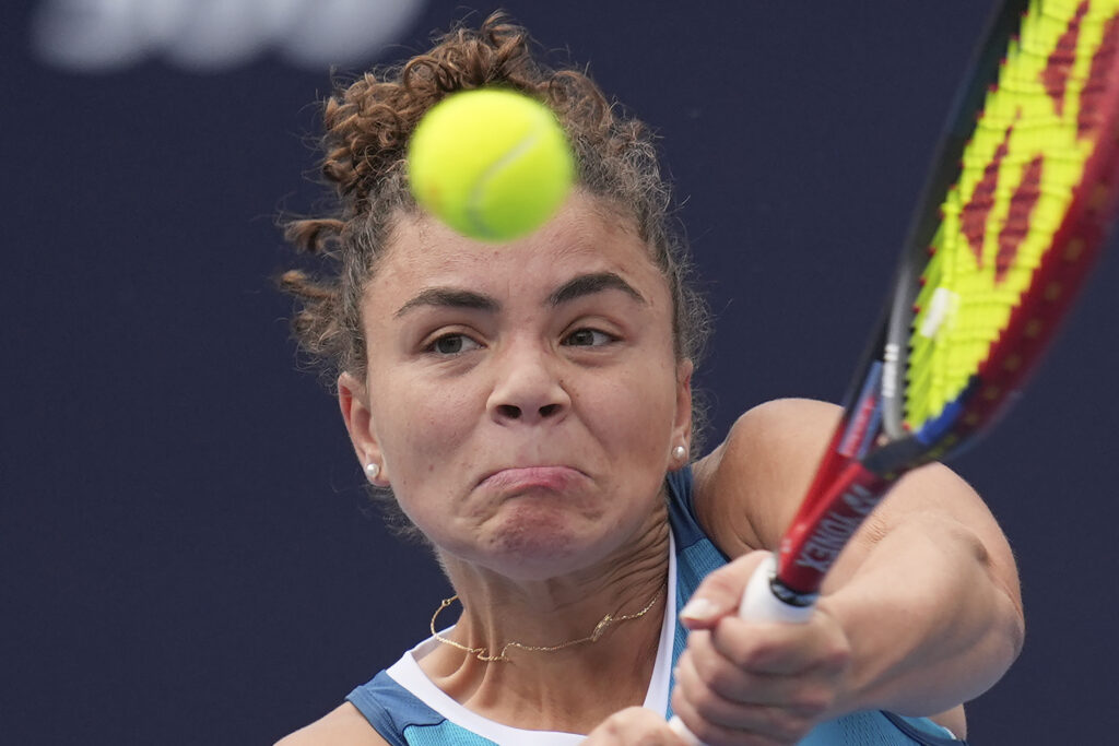 Jasmine Paolini of Italy returns a shot from Magda Linette of Poland during the China Open tennis tournament held at the National Tennis Center in Beijing, Monday, Sept. 30, 2024. (AP Photo/Ng Han Guan)