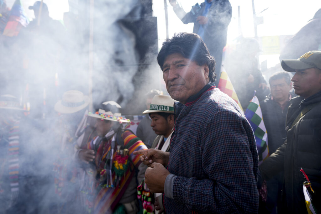 Former President Evo Morales participates in an offering to Mother Earth before leading a march to Bolivia's capital, as part of a political dispute with current President Luis Arce and to protest his handling of the economy, in Caracollo, Oruro, Bolivia, Tuesday, Sept. 17, 2024. (AP Photo/Juan Karita)