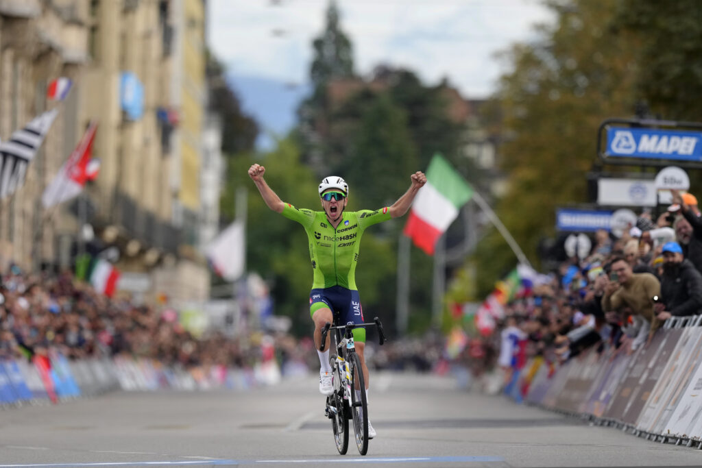 Slovenia's Tadej Pogacar crosses the finish line to win the Men Elite road race of the Cycling and Para-cycling Road World Championships in Zurich, Switzerland, Sunday, Sept. 29, 2024. (AP Photo/Peter Dejong)