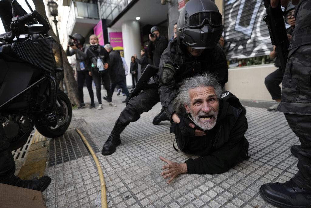 Police detain a protestor during a demonstration against President Javier Milei's veto of a pension raise in front of Congress in Buenos Aires, Argentina, Wednesday, Sept. 11, 2024. (AP Photo/Rodrigo Abd)