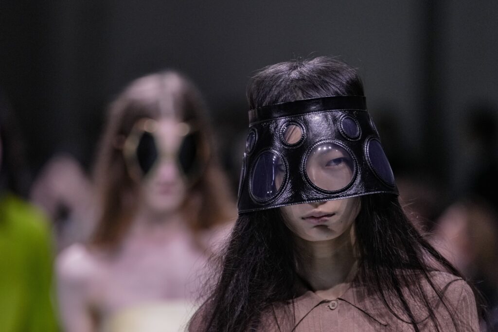 A model wears a creation as part of the Prada Spring Summer 2025 collection, that was presented in Milan, Italy, Thursday, Sept. 19, 2024. (AP Photo/Luca Bruno)