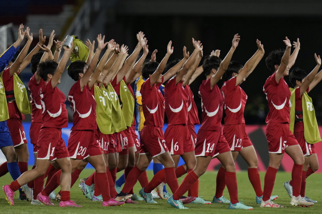 Players of North Korea walk off the field after defeating the United States in a U-20 Women's World Cup semifinal soccer match in Cali, Colombia, Wednesday, Sept. 18, 2024. (AP Photo/Fernando Vergara)