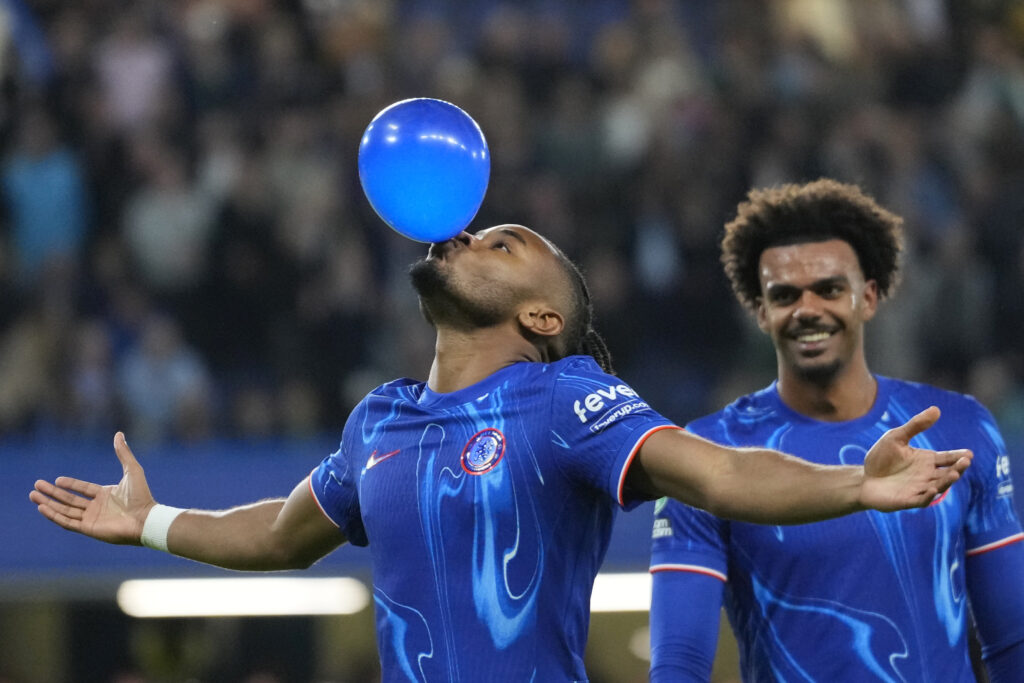 Chelsea's Christopher Nkunku celebrates after scoring his side's fifth goal during the English League Cup third round soccer match between Chelsea and Barrow at Stamford Bridge stadium in London, Tuesday, Sept. 24, 2024. (AP Photo/Kirsty Wigglesworth)