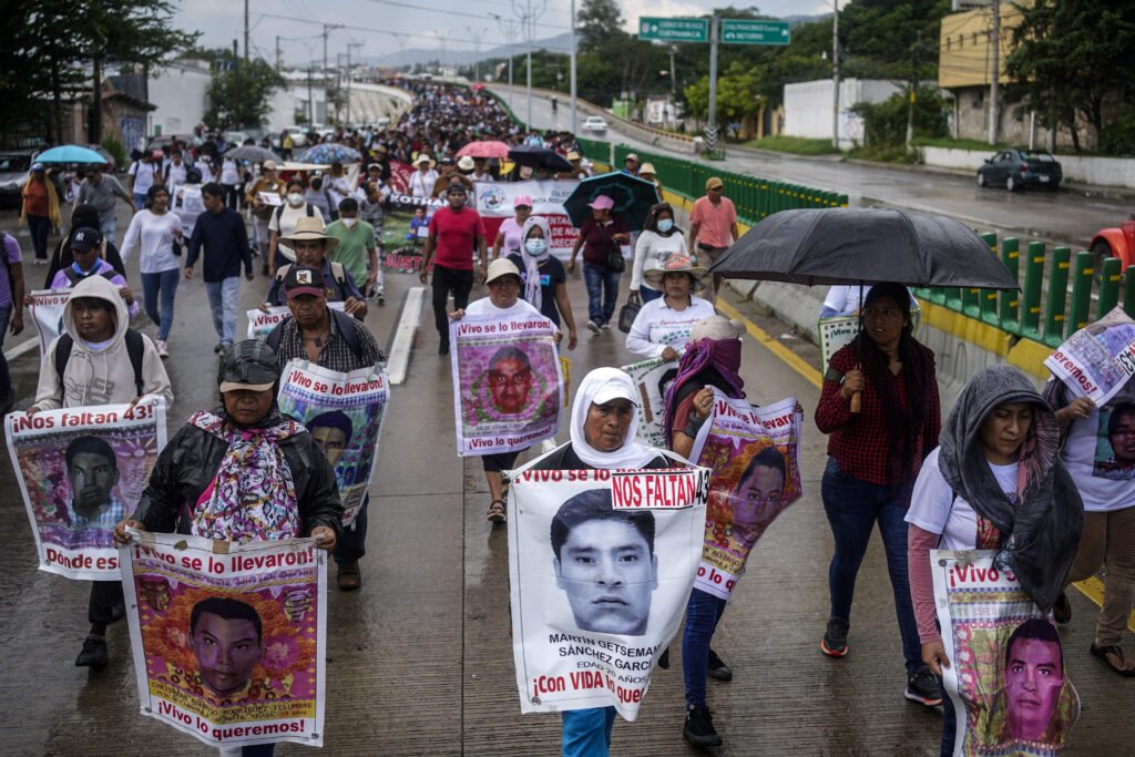 Relatives of the 43 Ayotzinapa students who went missing almost 10 years ago march to demand justice for their loved ones in Chilpancingo, Mexico, Wednesday, Sept. 18, 2024. (AP Photo/Felix Marquez)