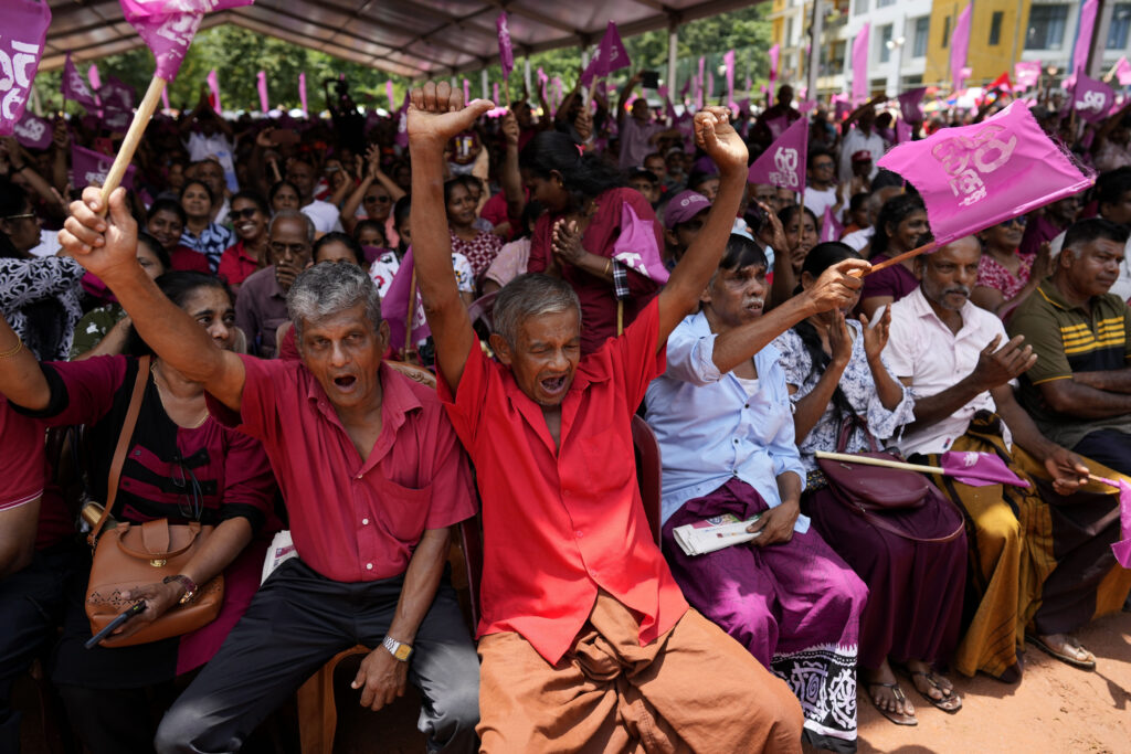 Supporters of National People's Power cheer their leader and presidential candidate Anura Kumara Dissanayake during a public rally in Dehiowita, Sri Lanka, Tuesday, Sept. 17, 2024. (AP Photo/Eranga Jayawardena)