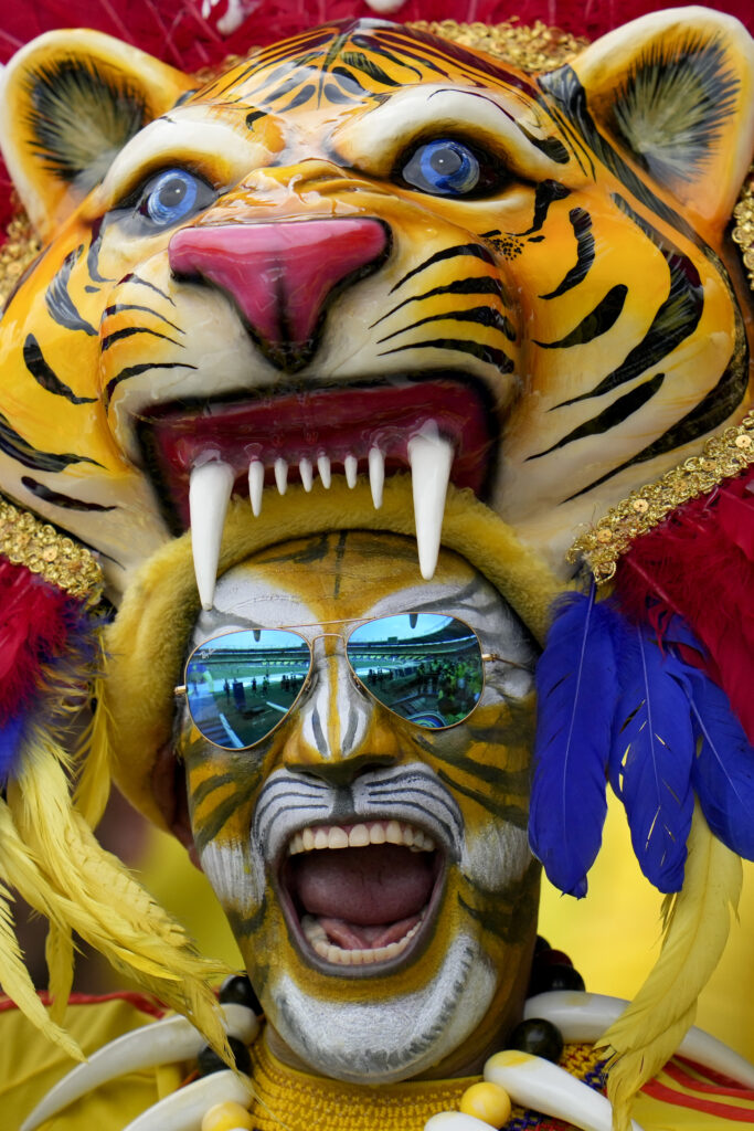 A Colombia fan poses for a photo prior to a qualifying soccer match for the FIFA World Cup 2026 against Argentina at the Metropolitano Roberto Melendez stadium in Barranquilla, Colombia, Tuesday, Sept. 10, 2024. (AP Photo/Fernando Vergara)