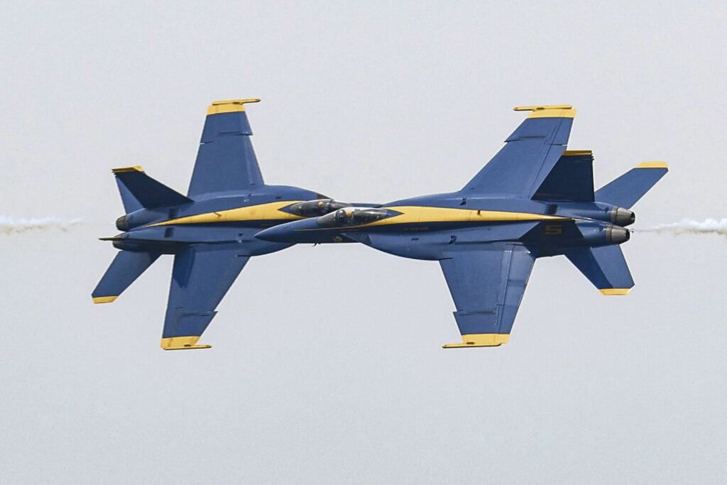 U.S. Navy Blue Angels pilots make a close pass while flying their F/A-18 Super Hornets over the Ohio River, Thursday, Sept 12, 2024, in Owensboro, Ky, during a practice for their upcoming weekend performance during the Owensboro Air Show. (Greg Eans/The Messenger-Inquirer via AP)