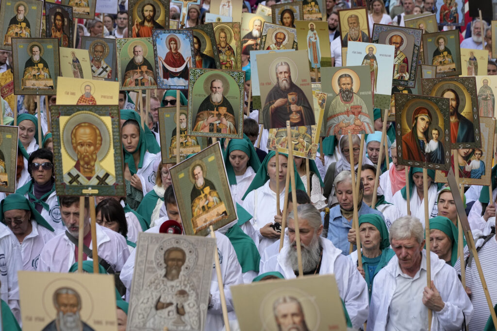 Orthodox believers carry icons as they take part in a procession along Nevsky Prospect to mark the 300 years anniversary of the Alexander Nevsky Monastery in St. Petersburg, Russia, Thursday, Sept. 12, 2024. Russian Orthodox faithful commemorate the date of September 12, 1724, when Russian Tsar Peter The Great transferred the relics of prince Alexander Nevsky from town of Vladimir to St.Petersburg, the new capital of Russia. (AP Photo/Dmitri Lovetsky)