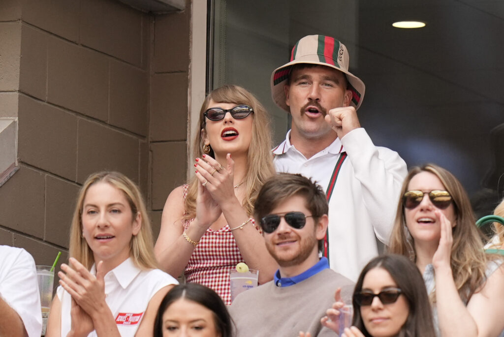 Taylor Swift and Kansas City Chiefs tight end Travis Kelce watch play between Jannik Sinner, of Italy, and Taylor Fritz, of the United States, during the men's singles final of the U.S. Open tennis championships, Sunday, Sept. 8, 2024, in New York. AP Photo/Seth Wenig