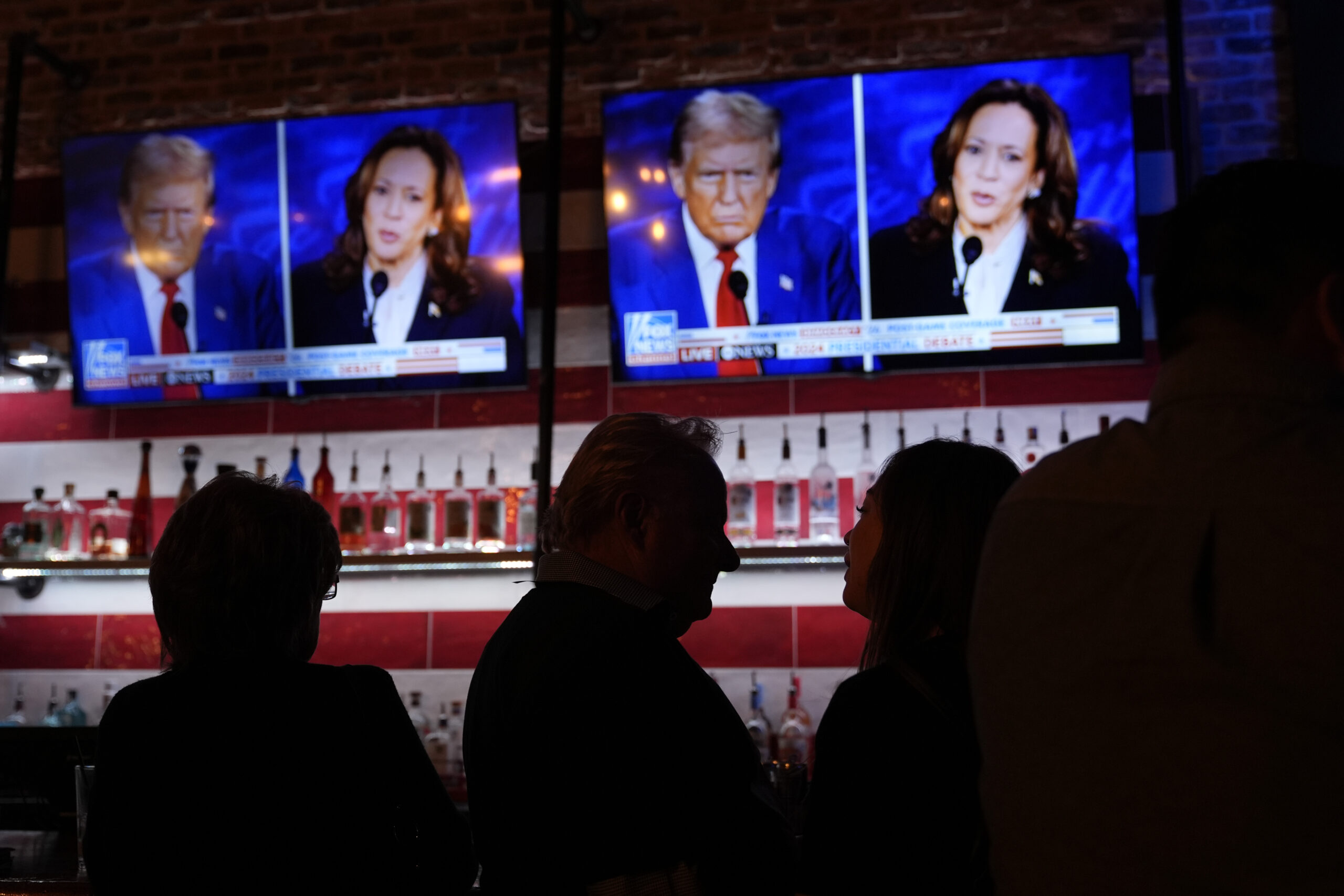 Viewers gather to watch a debate between Democratic presidential nominee Vice President Kamala Harris and Republican presidential nominee former President Donald Trump at the Angry Elephant Bar and Grill, Tuesday, Sept. 10, 2024, in San Antonio. AP Photo/Eric Gay