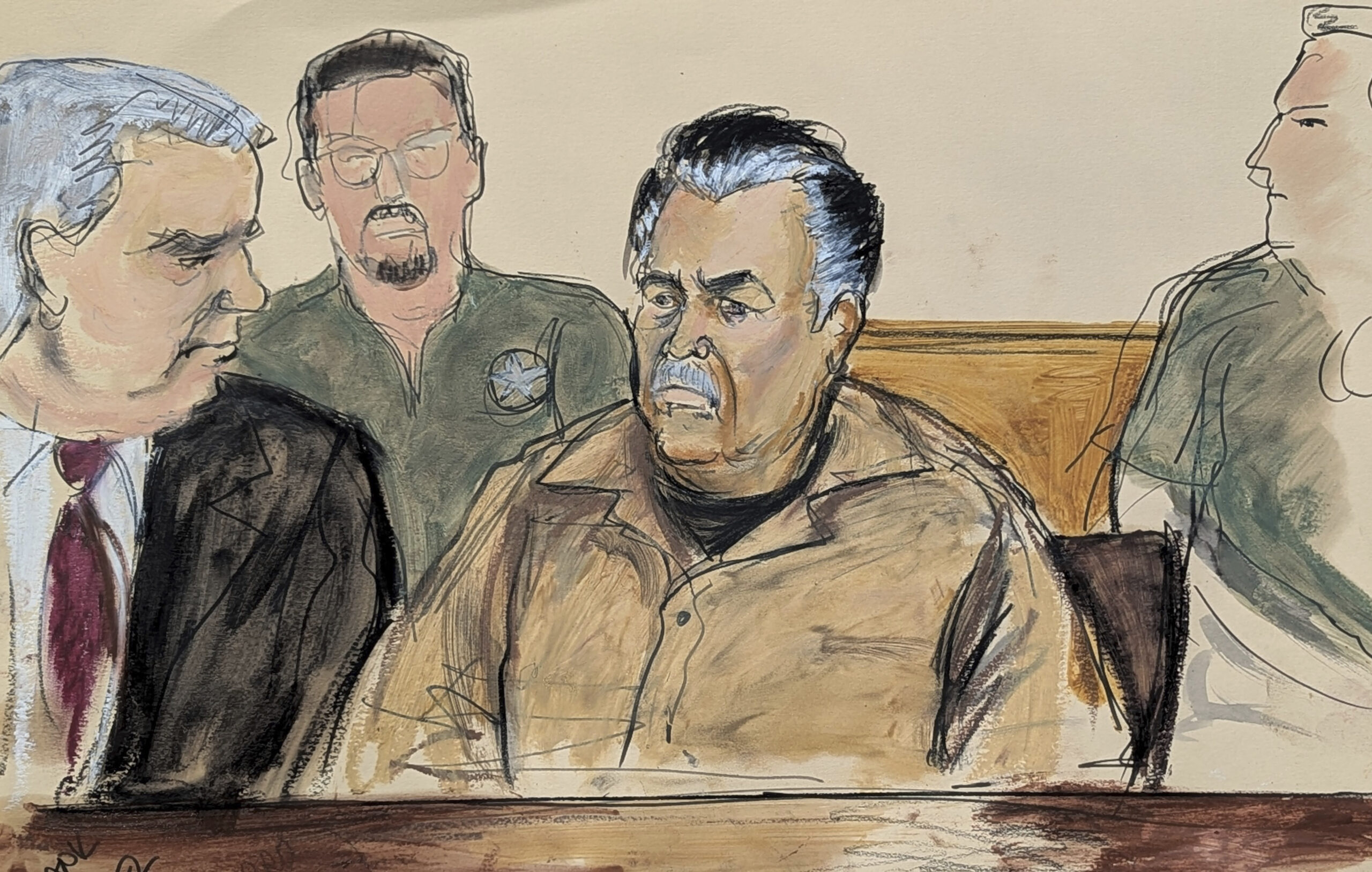 In this courtroom sketch, Ismael Zambada Garcia, El Mayo, center, is seated beside his defense attorney Frank Perez, left, in Federal court in Brooklyn, Friday, Sept. 13, 2024. Elizabeth Williams via AP