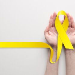 A yellow ribbon representing the International Association for Suicide Prevention and the Yellow Ribbon Suicide Prevention Program. This year, National Suicide Prevention Week ran from Sept. 8-14, with World Suicide Prevention Day falling on Sept. 10. Photo: AlexBlogoodf/Adobe Stock