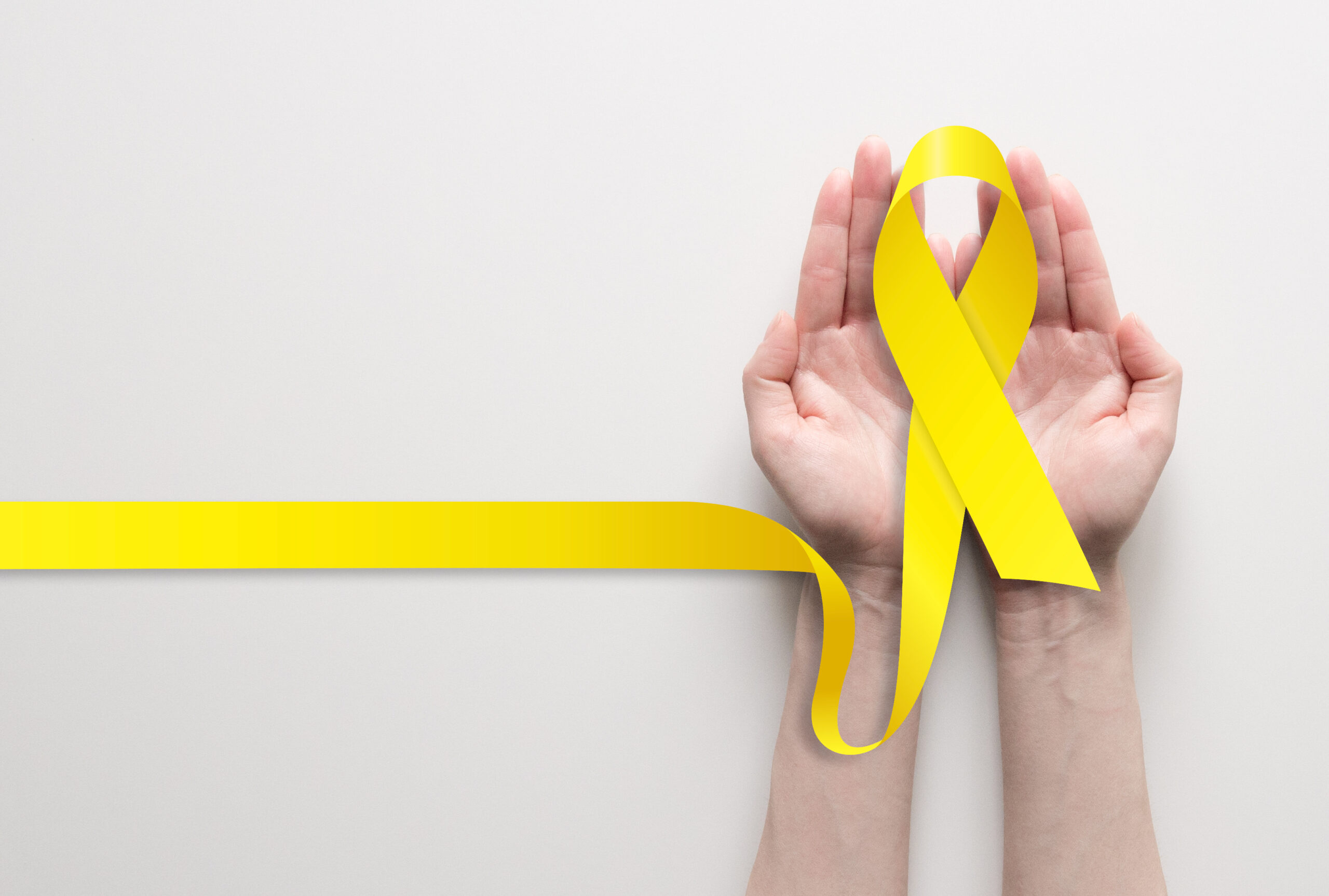 A yellow ribbon representing the International Association for Suicide Prevention and the Yellow Ribbon Suicide Prevention Program. This year, National Suicide Prevention Week ran from Sept. 8-14, with World Suicide Prevention Day falling on Sept. 10. Photo: AlexBlogoodf/Adobe Stock