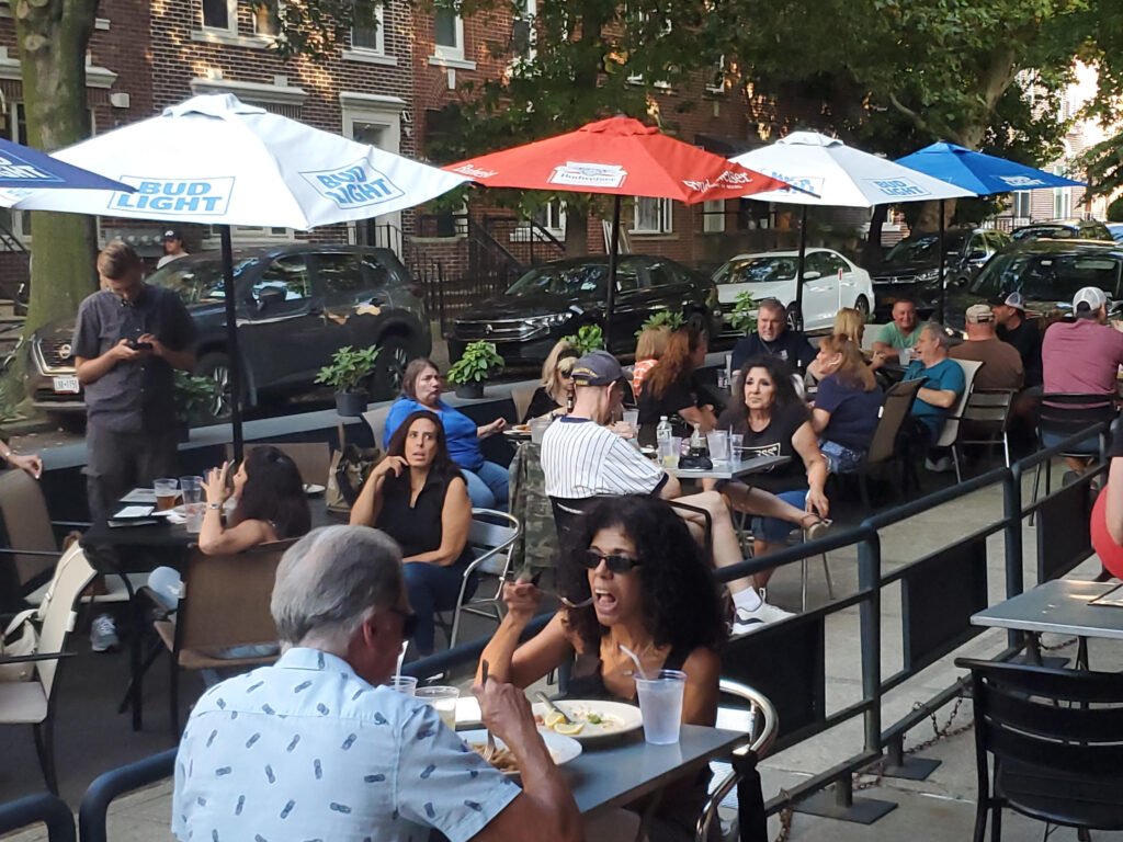 Bay Ridgians enjoying some local cuisine along the avenue. Photo by Arthur De Gaeta
