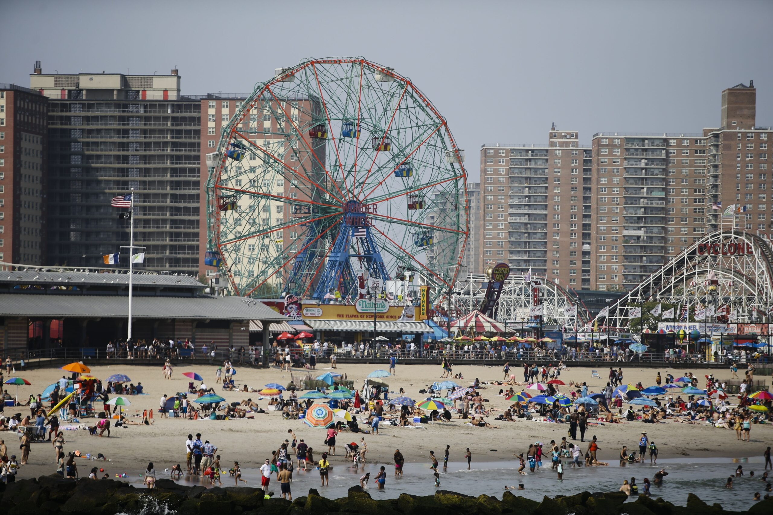 Beachgoers at Coney Island this summer experienced a quieter season as Brooklyn saw historic lows in gun violence, a trend confirmed by both official data and observations from those within the community. Photo: Frank Franklin II/AP