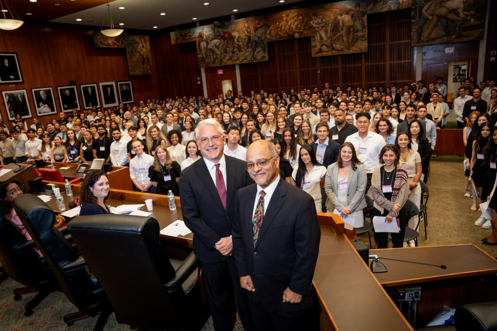 Dean David Meyer and Judge Ramon Reyes Jr. '92 stand at the podium in the ceremonial courtroom of the U.S. District Court for the Eastern District of New York, addressing more than 400 new Brooklyn Law School students during the 2024 Convocation. Behind them, the incoming class listens, marking the beginning of their legal journey. Photos courtesy of Brooklyn Law School