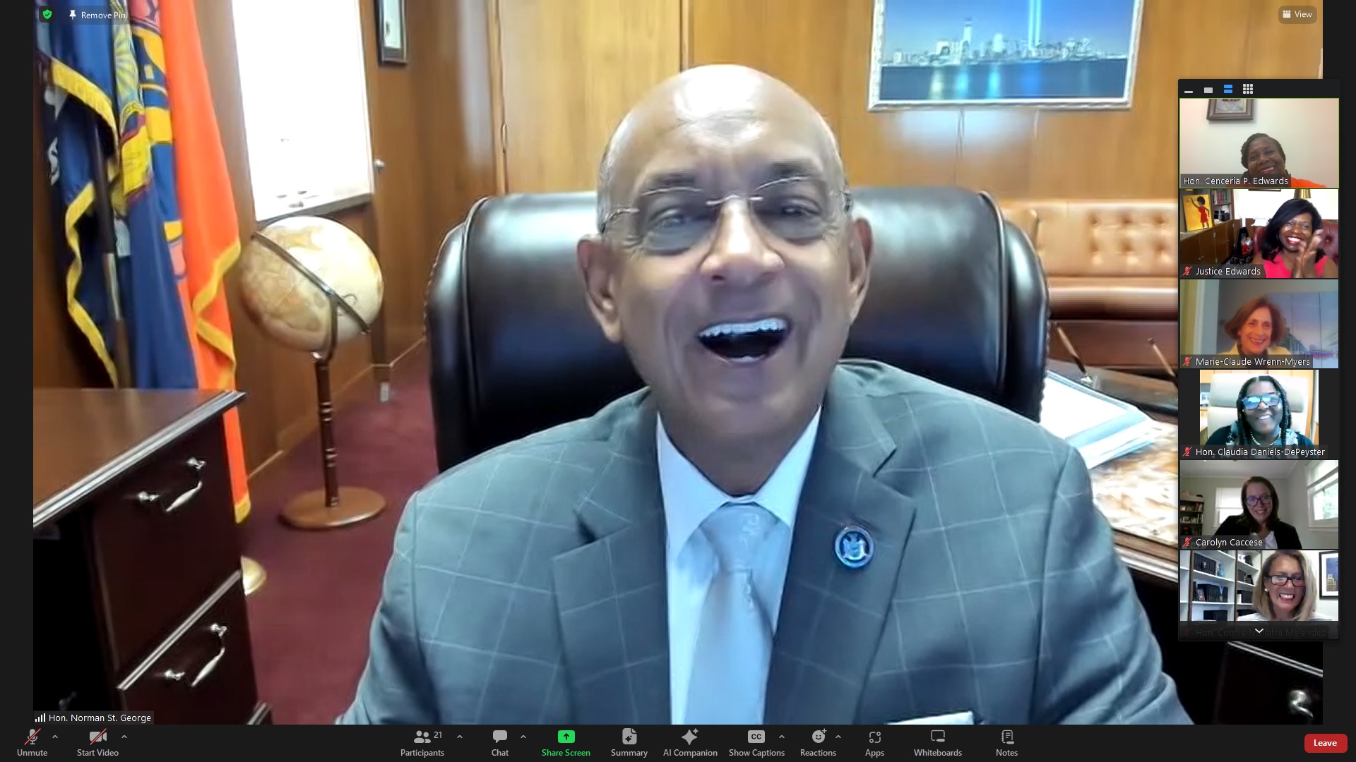 Hon. Norman St. George sharing a light moment during the BWBA's "Lunch with a Judge" series, where he discussed his career and experiences with members. Screenshot via Zoom