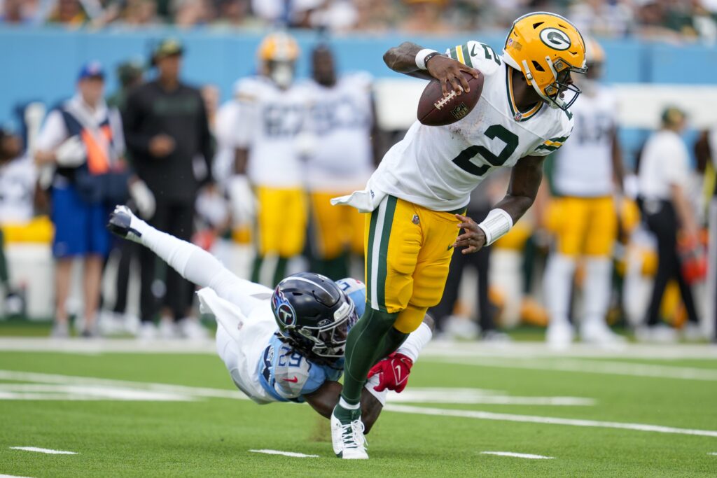 Tennessee Titans' Jarvis Brownlee Jr. tries to stop Green Bay Packers' Malik Willis during the first half of an NFL football game Sunday, Sept. 22, 2024, in Nashville, Tenn. (AP Photo/George Walker IV)