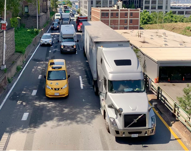 Overweight trucks like these have caused substantial damage to the Brooklyn-Queens Expressway. Under the microhubs plan, they could load their packages onto smaller vehicles at dedicated areas. Eagle file photo by Mary Frost