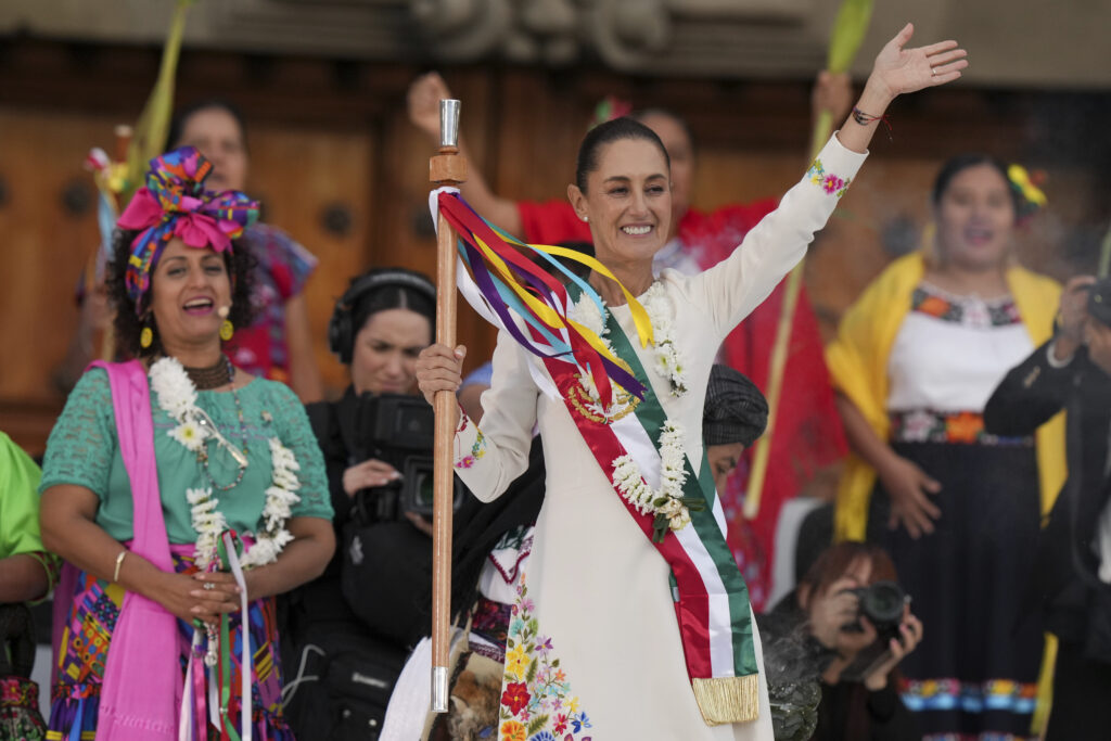 President Claudia Sheinbaum waves to supporters in the Zócalo, Mexico City's main square, during a rally on her inauguration day, Tuesday, Oct. 1, 2024. (AP Photo/Fernando Llano)