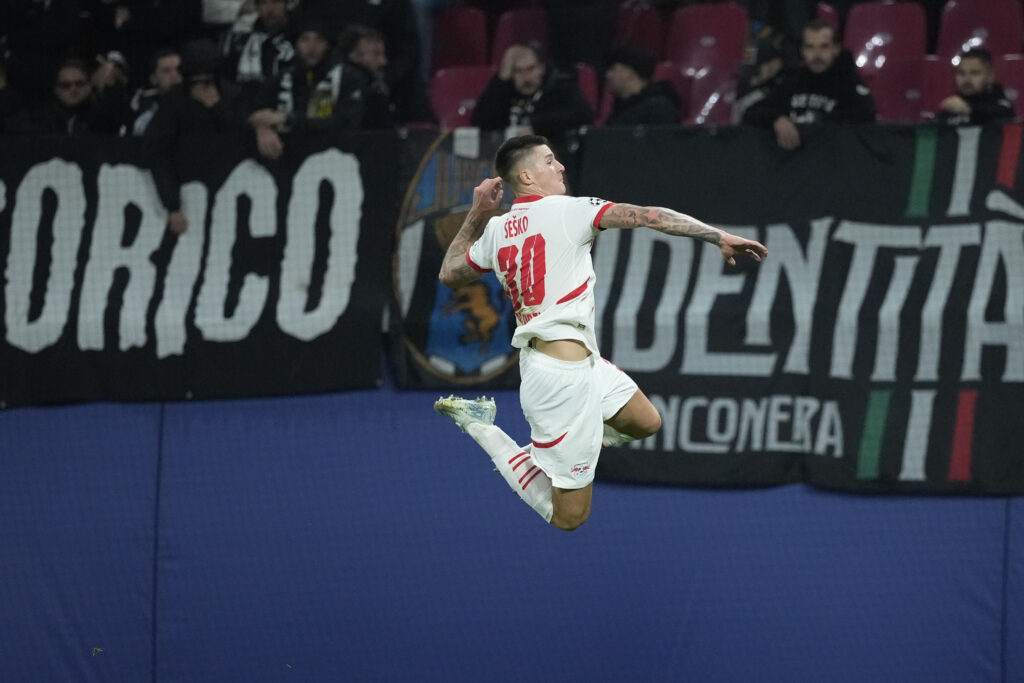 Leipzig's Benjamin Sesko celebrates after he scored during the UEFA Champions League opening phase soccer match between Leipzig and Juventus in Leipzig, Germany, Wednesday, Oct. 2, 2024.(AP Photo/Ebrahim Noroozi)