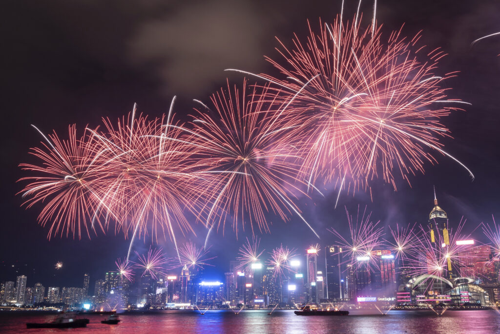 Fireworks explode over Victoria Harbour to mark the 75th National Day of the People's Republic of China, at Tsim Sha Tsui in Hong Kong, Tuesday, Oct. 1, 2024. (AP Photo/Chan Long Hei)