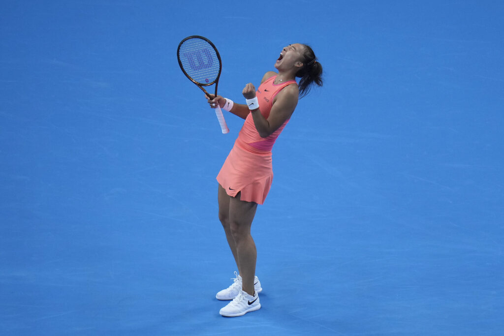 Zheng Qinwen of China celebrates after defeating Mirra Andreeva of Russia in the women's singles quarterfinals match of the China Open tennis tournament, at the National Tennis Center in Beijing, Friday, Oct. 4, 2024. (AP Photo/Andy Wong)