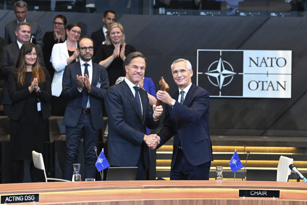 The outgoing NATO Secretary General Jens Stoltenberg, right, welcomes the new NATO Secretary General Mark Rutte during a handover ceremony at NATO headquarters in Brussels, Belgium, Tuesday, Oct. 1, 2024. (AP Photo/Harry Nakos)