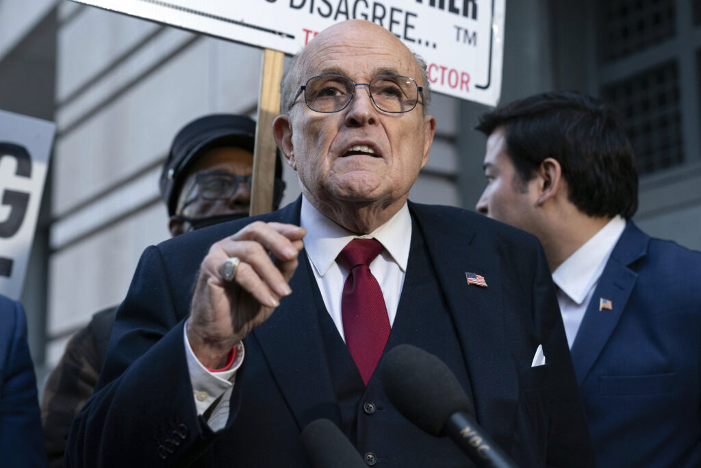 Rudy Giuliani speaks during a news conference outside federal court in Washington, Dec. 15, 2023. AP Photo/Jose Luis Magana, File