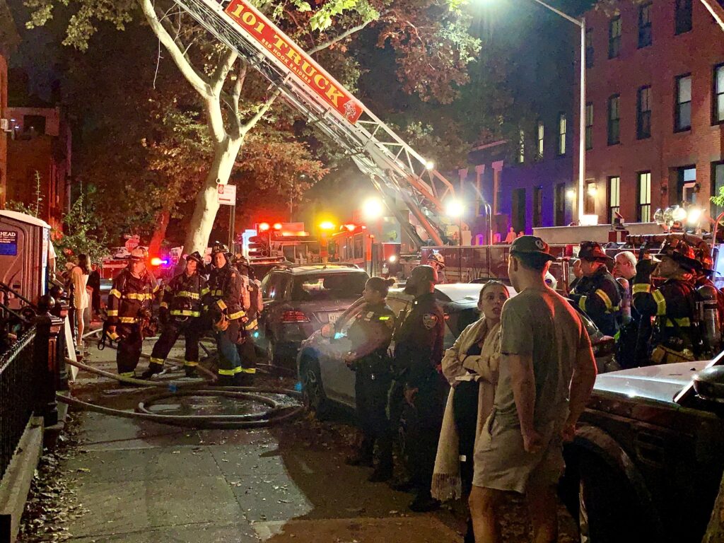 Anxious tenants stand outside as firefighters soak the blaze at 389 DeGraw St. in Carroll Gardens, Brooklyn on Friday, Oct. 11. Photo: Mary Frost, Brooklyn Eagle