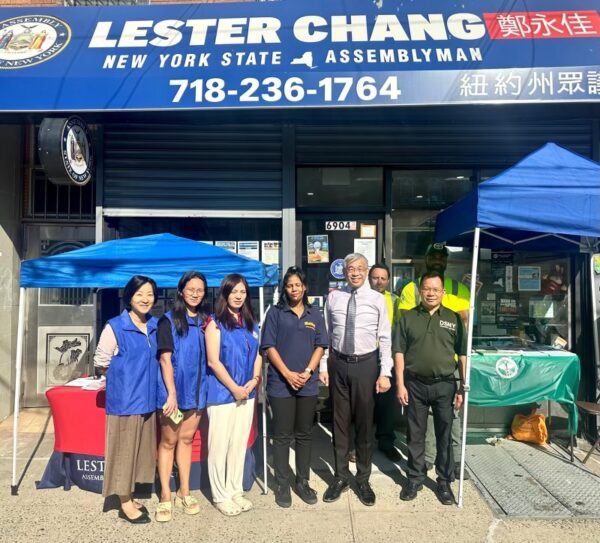 Lester Chang, Crystal Jalloh, NYC Dept. of Sanitation representatives, and Chang staff members. Photo by Wayne Daren Schneiderman