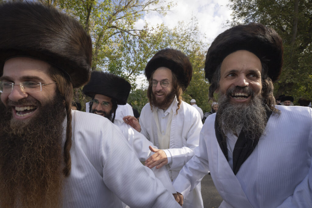 Orthodox Jews dance at the tomb of Rabbi Nachman, the great grandson of the founder of Hasidic movement, to mark the Jewish new year in the town of Uman, 200 kilometers (125 miles) south of Ukraine's capital Kyiv, Ukraine, Thursday, Oct. 3, 2024. (AP Photo/Efrem Lukatsky)