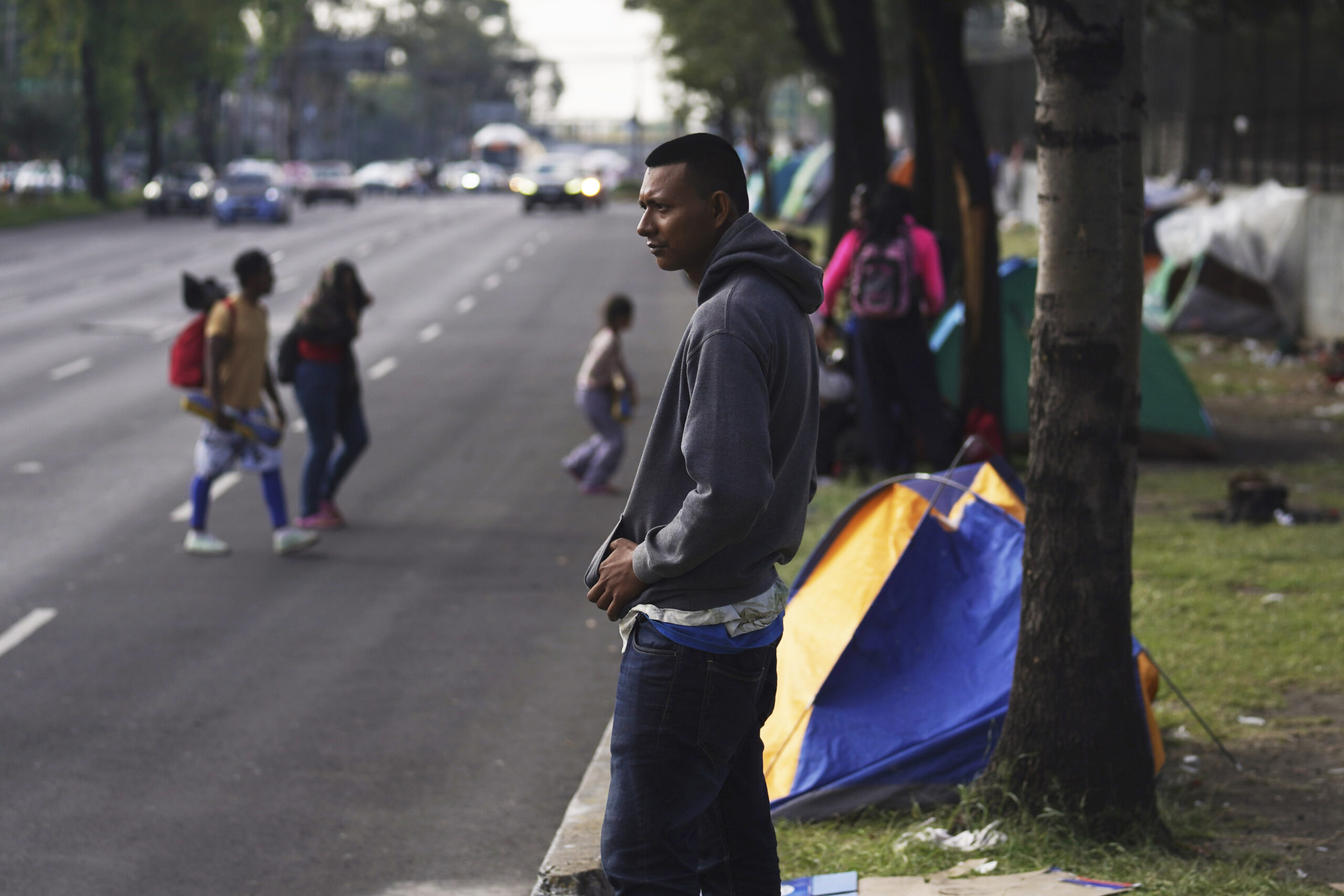 Jorge Menjivar, from El Salvador, stands outside the Northern Bus Station in Mexico City, Sept. 22, 2023, during his journey north to the U.S. AP Photo/Marco Ugarte, File