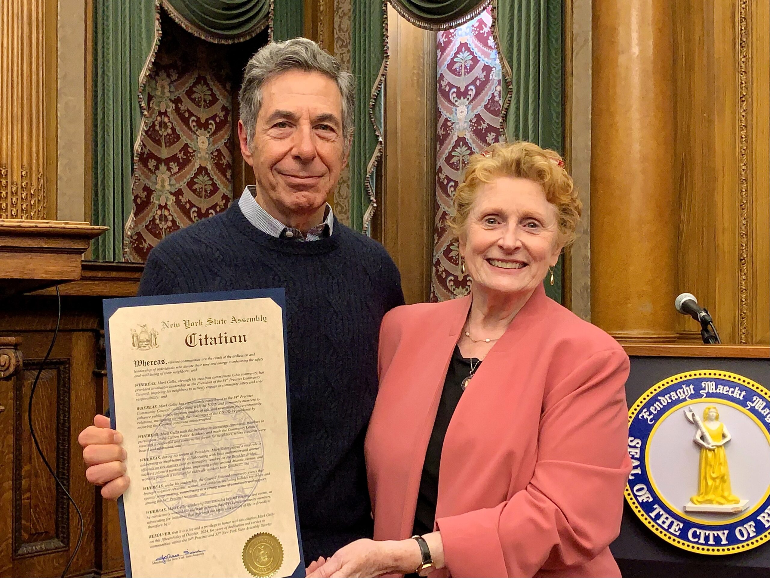 Assemblymember Jo Anne Simon presented Mark Gelbs, former president of the 84th Precinct Community Council, with a NYS Assembly Citation on Oct. 15. Photo: Mary Frost, Brooklyn Eagle