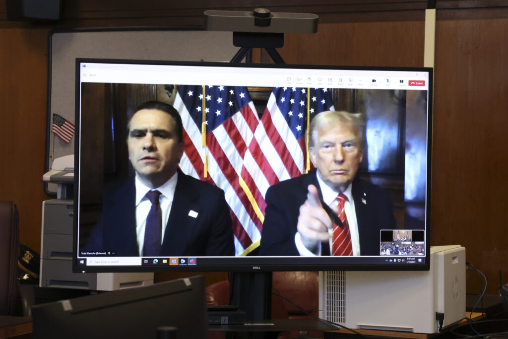 U.S. President-elect Donald Trump appears remotely for a sentencing hearing in front of New York State Judge Juan Merchan in the criminal case in which he was convicted in 2024 on charges involving hush money paid to a porn star, at New York Criminal Court in Manhattan in New York, Jan. 10, 2025. Brendan McDermid via AP, Pool