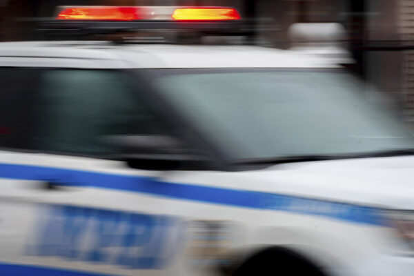 A police car drives through Brooklyn, Dec. 16, 2022. Photo: Julia Nikhinson/AP, File