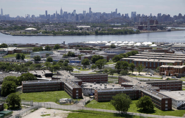 In a June 20, 2014, file photo, the Rikers Island jail complex stands in New York with the Manhattan skyline in the background. Photo: Seth Wenig/AP