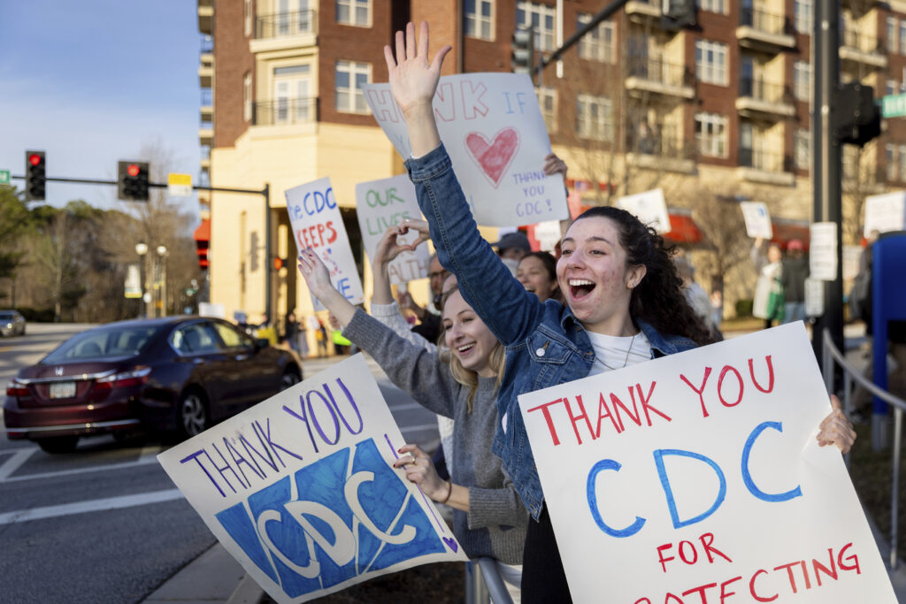 Emory public health students, including Haley Cionfolo, right, cheer in support of Centers for Disease Control and Prevention Photo: CDC) employees leaving the CDC headquarters during a protest against recent CDC layoffs, in Atlanta, Tuesday, Feb. 18, 2025.
