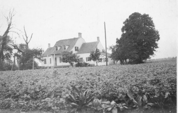 The Lott family farm, with the house in the background, in 1922. Within a few years, farming here would come to an end. Photo courtesy of Friends of the Lott House
