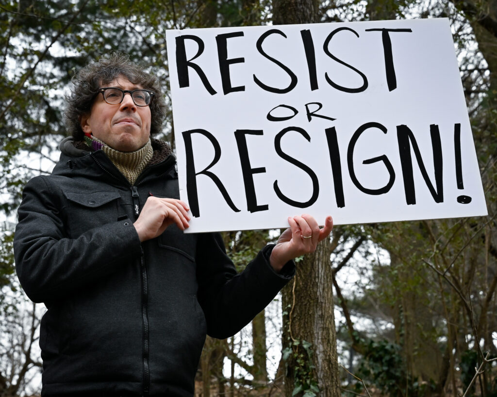Activists with the Indivisible Brooklyn urged Sen. Chuck Schumer to stop what many fear is a coup at a rally outside his home in Park Slope. Photo by Gabriele Holtermann