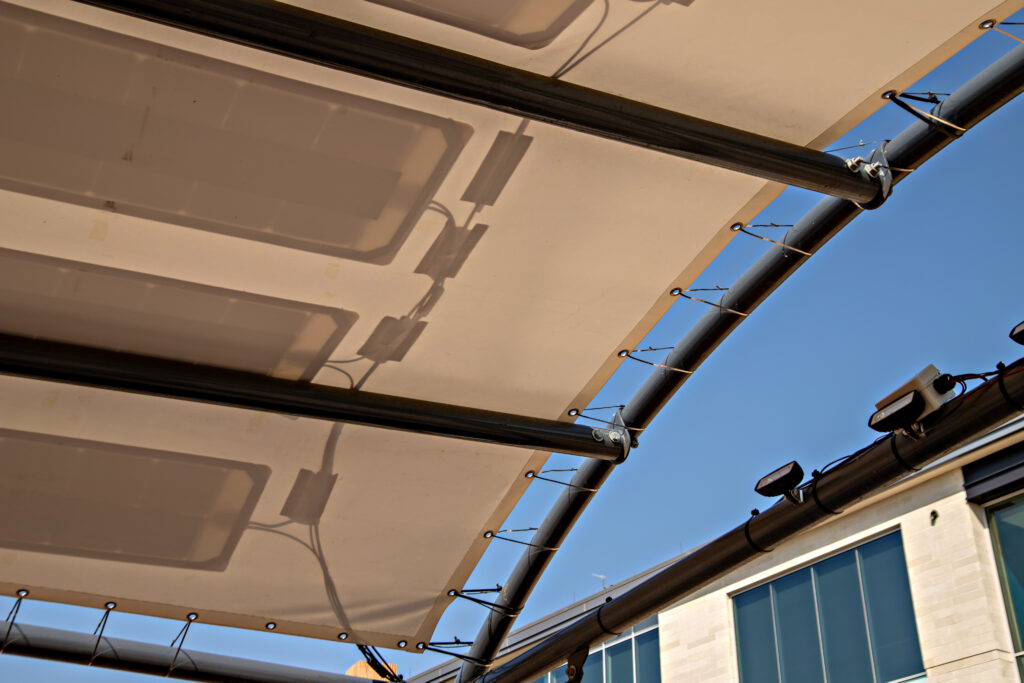 Pvilion's Quad Pol Solar Sail. It can be installed as temporary, permanent or semi-permanent. It was designed for farmers markets, covering picnic tables, event booths and any other outdoor gathering. Photo courtesy of Pvilion
