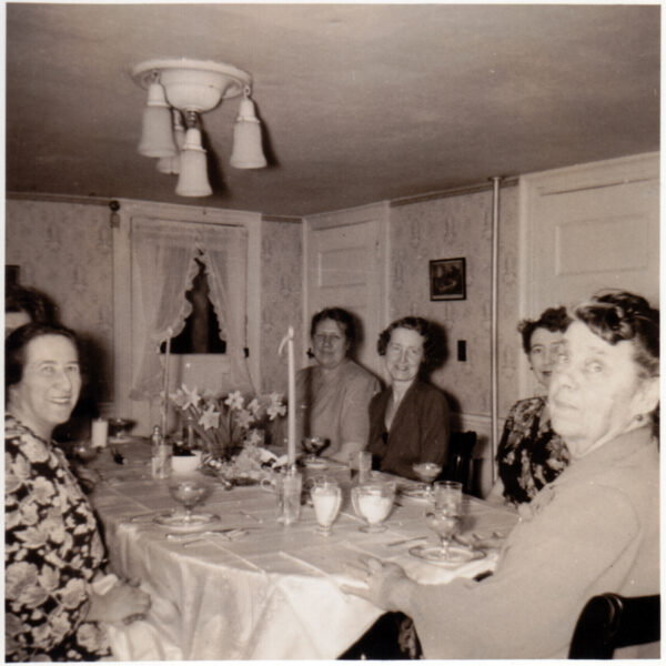 Sitting around the table at the Lott House in 1942, having a good time, are Arlene V., Eddie S., Rica Brenner and Grandma Suydam. Photo courtesy of Friends of the Lott House