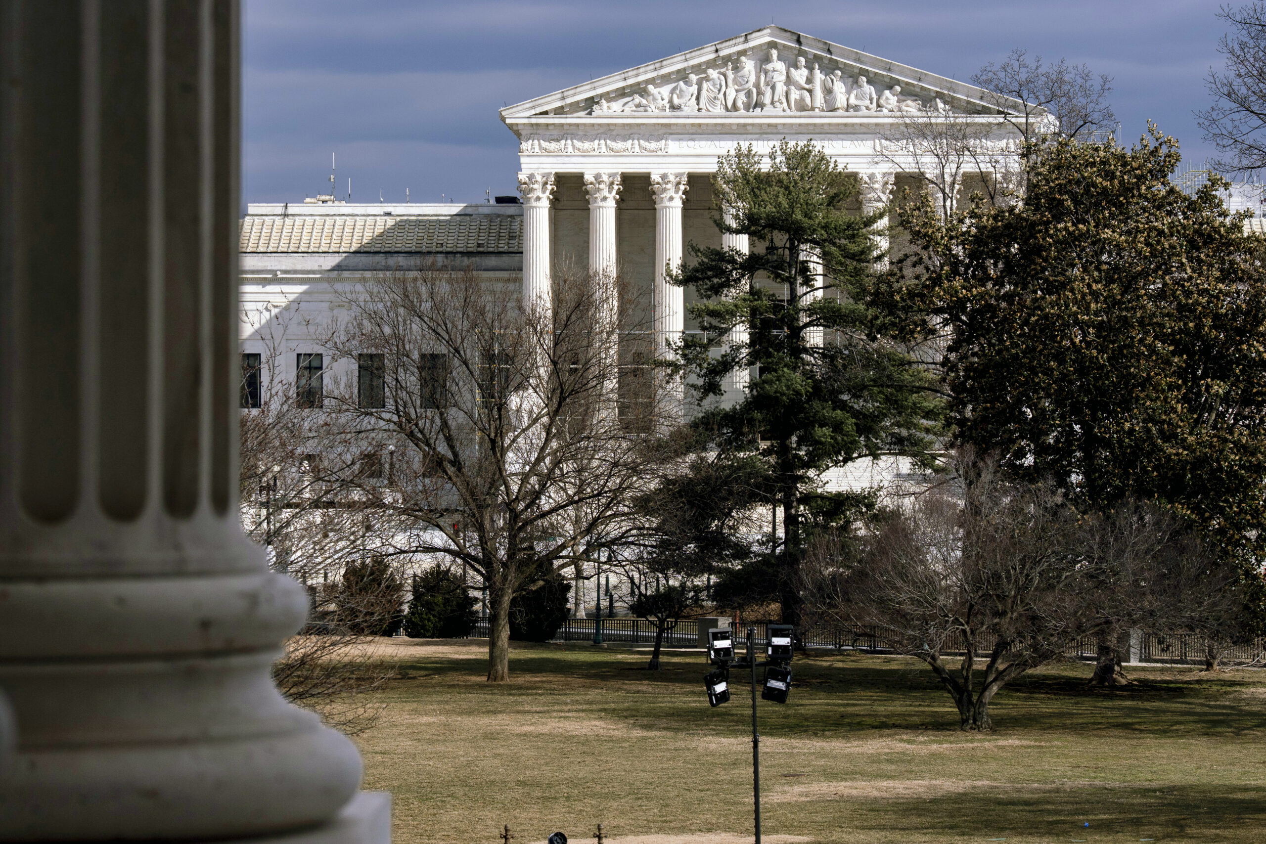 The Supreme Court is seen in the distance, framed through columns of the U.S. Senate at the Capitol in Washington, Feb. 20, 2025. Photo: J. Scott Applewhite/AP