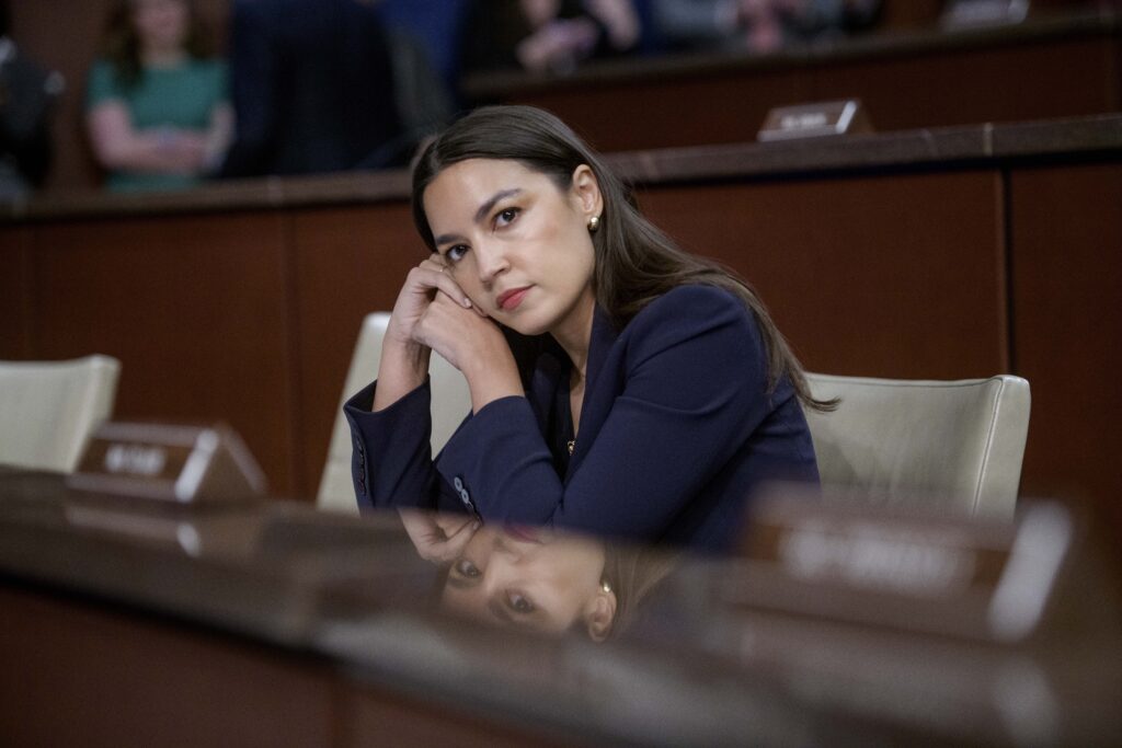 Rep. Alexandria Ocasio-Cortez, D-N.Y., listens to the testimony of the witnesses during a House Committee on Oversight and Government Reform hearing with Sanctuary City Mayors on Capitol Hill, Wednesday, March 5, 2025, in Washington.