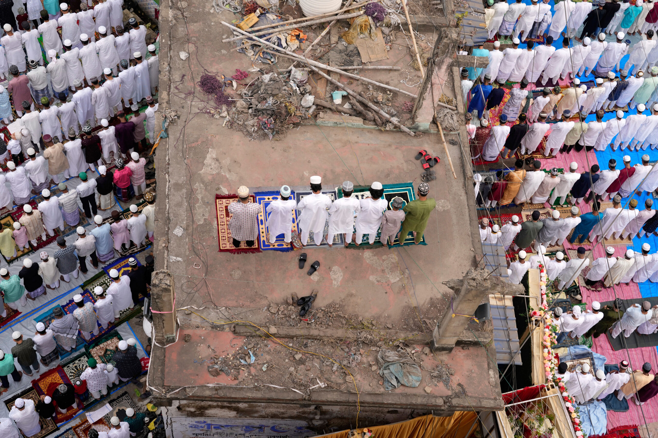 Muslims perform Eid al-Fitr prayers marking the end of the holy fasting month of Ramadan in Bankra, Howrah district, India, Monday, March 31, 2025.