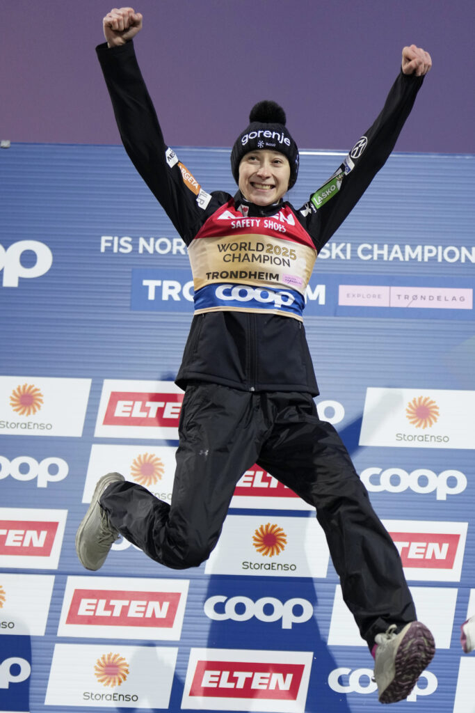 Nika Prevc, of Slovenia, jumps on the podium celebrating after winning the gold medal in the ski jumping women's large hill individual competition at the Nordic World Ski Championships in Trondheim, Norway, Friday, March 7, 2025.