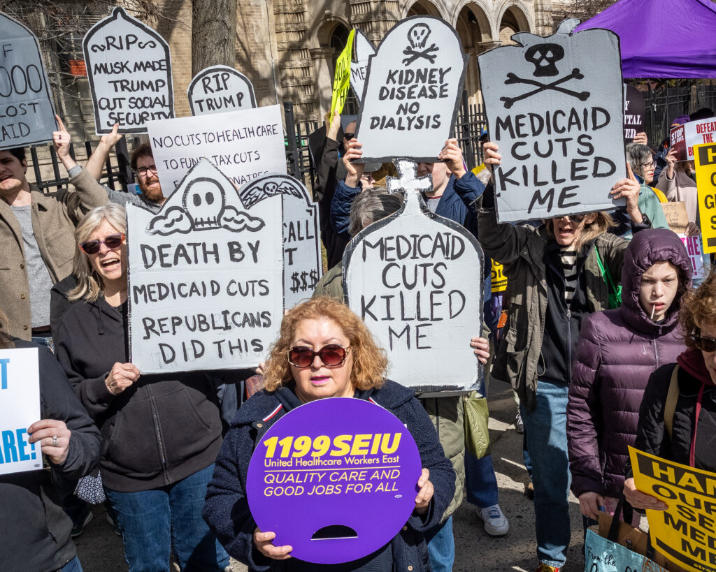 A coalition of progressive organizations and unions, including Indivisible Brooklyn and 1199 SEIU United Healthcare Workers East, rally in the Bay Ridge neighborhood of Brooklyn, New York, on March 22, 2025, against the funding cuts to federal health care programs and tax breaks for billionaires. Brooklyn Eagle photo by Gabriele Holtermann