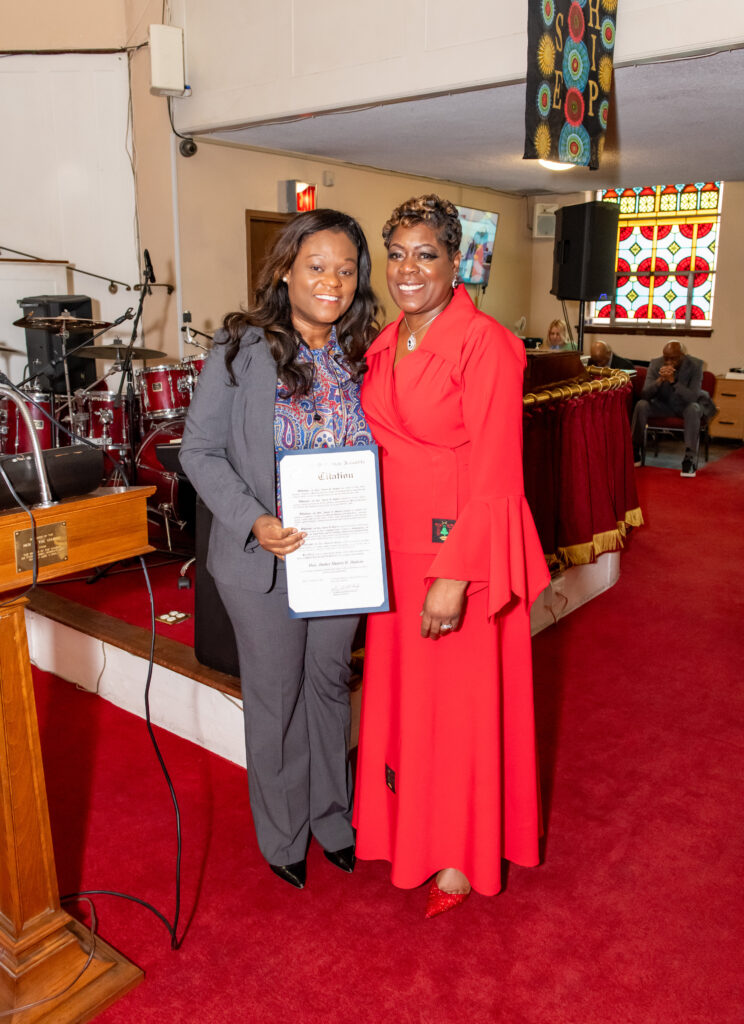 Assemblymember and Brooklyn Democratic Party Chair Rodneyse Bichotte Hermelyn (left) presenting Hon. Sharen Hudson with a citation. Photo: Roger Archer/Phaats Photos