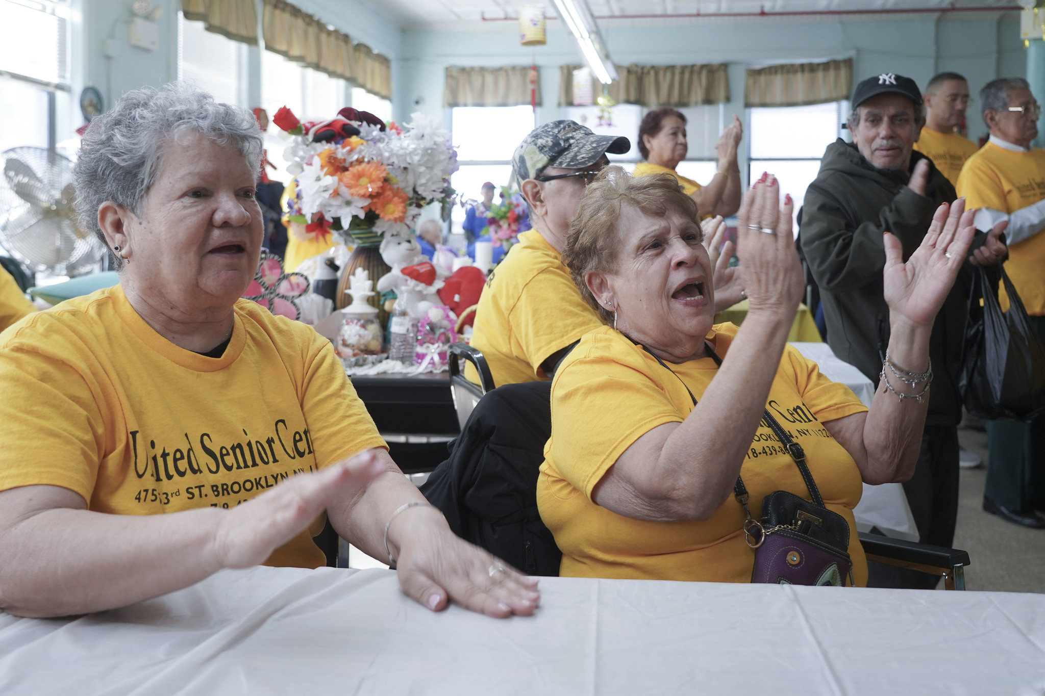 Seniors at the United Senior Center of Sunset Park applaud the show of support from elected officials. Photo: Gerardo Romo / NYC Council Media Unit